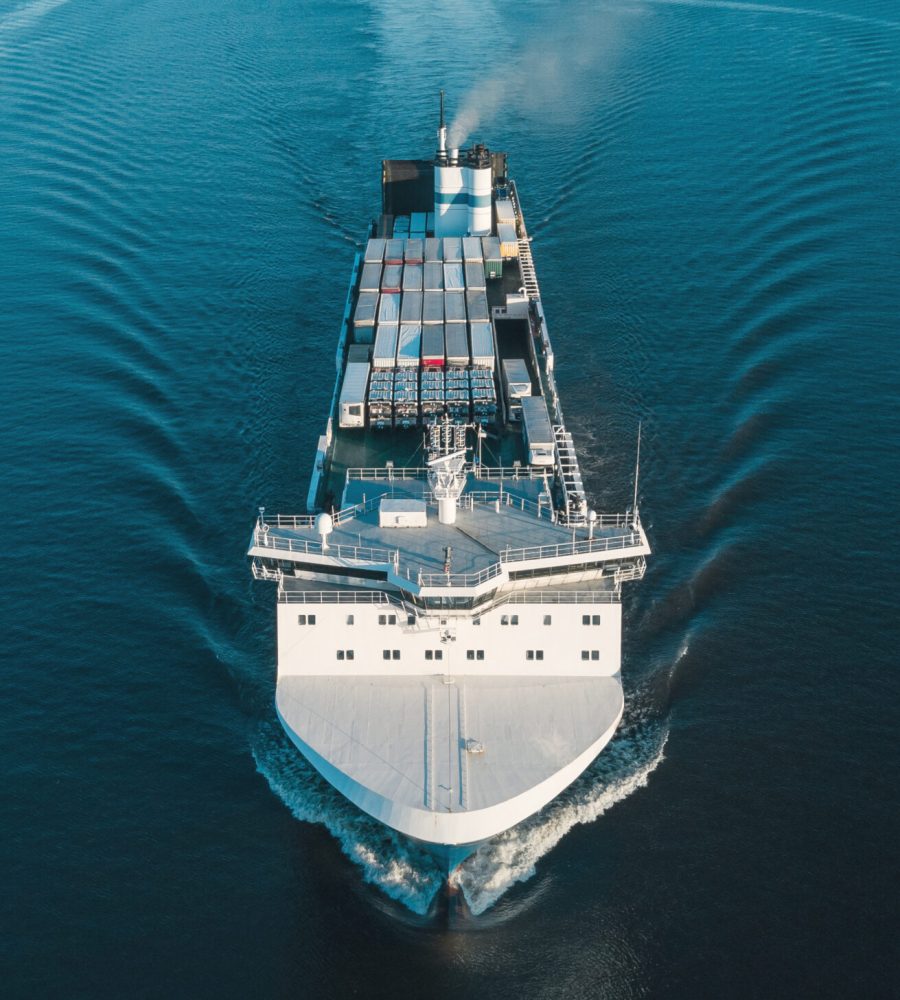 Aerial view of vehicles carrier in the sea